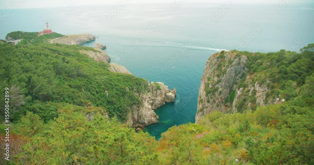 custom made wallpaper toronto digitalLighthouse atop green cliffs overlooking serene blue sea waters on Capri Island