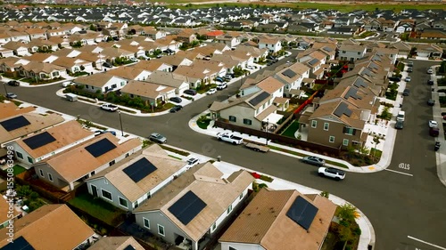 aerial view of a middle class brand new residential houses neighborhood in a city suburbs. suburbia