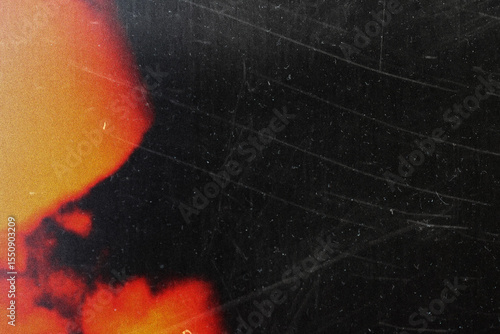 grungy black texture with vintage scratches and orange light leak for edgy web design, print media background, and creative branding graphics