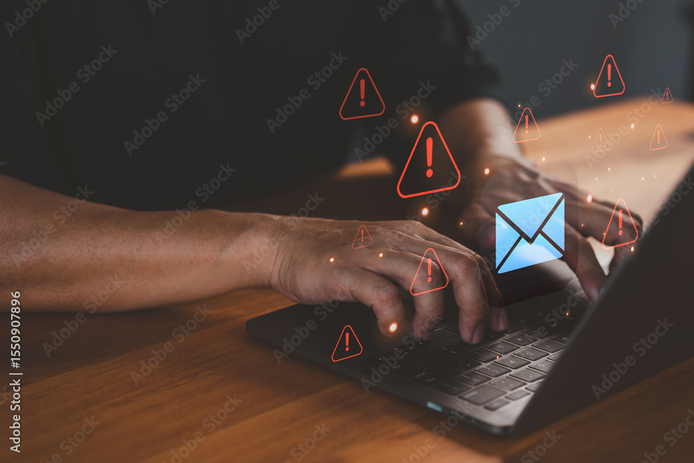 Plakát Person types on a laptop computer while warning email icons ...