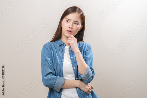 Bilde på lerret Portrait of face expression stress, asian young woman, confused girl standing pose looking camera in casual