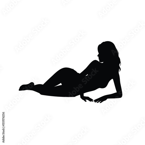 Silhouette of a seductive woman posing provocatively while reclining on her side