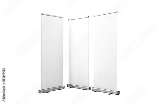 Three white blank roll up banners standing side by side against a black background in a studio setting