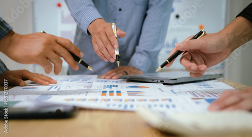 Wallpaper Mural A professional business team collaborates around a conference table, analyzing charts, discussing strategies, reviewing reports, and planning innovative solutions to drive growth, efficiency, and long Torontodigital.ca