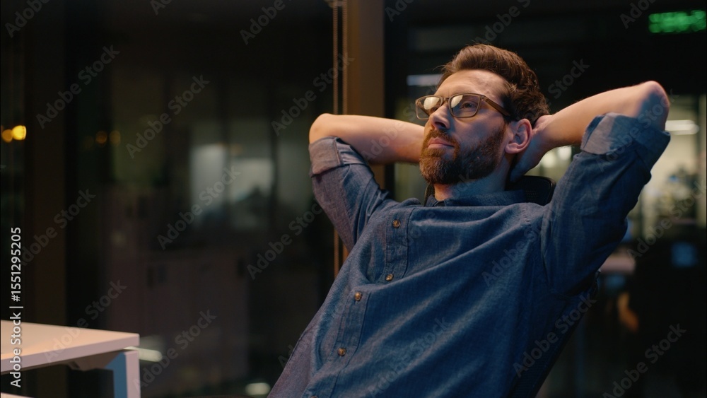 Obraz premium Caucasian business man businessman finish online working overtime end computer job complete task overworked tired employer guy male in night evening office relaxing hands behind head pause relaxing