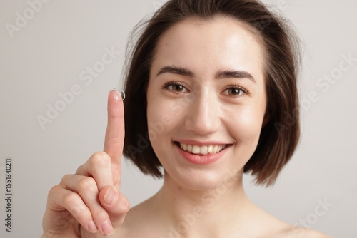 Wallpaper Mural Woman with contact lens on light background Torontodigital.ca
