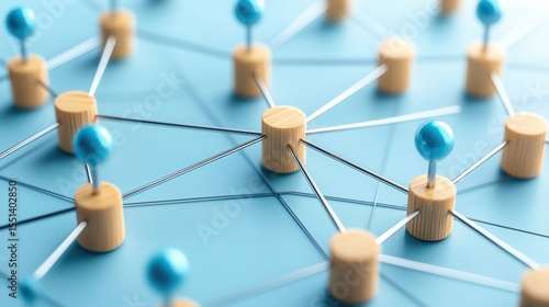 Close-up of interconnected wooden pegs and blue pins connected with metal rods on a blue surface representing network and connections