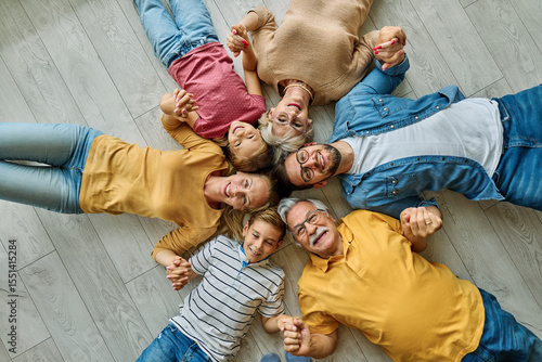 Tapeta Portrait of a three generation family, grandparents, parents and children sittin