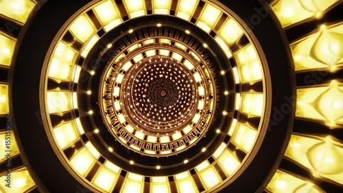 An abstract, mandala-like pattern of bright golden lights on a dark background, concept of light and energy, footage.