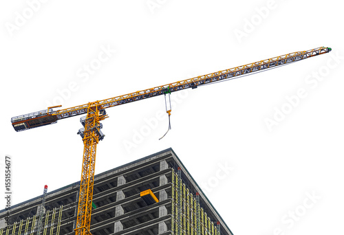 Isolated on transparent background photo of construction process of multi-storey monolithic building using orange-colored industrial construction crane of tower type to coupling of load is not hooked