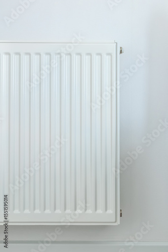 Wallpaper Mural Partial view of a white radiator on a plain wall with subtle lighting, highlighting clean design and modern heating solution for home interiors Torontodigital.ca