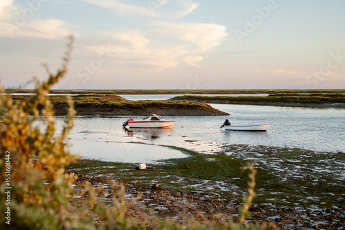 Boats on the water in the beautiful natural park of Ria Formosa Faro, Portugal