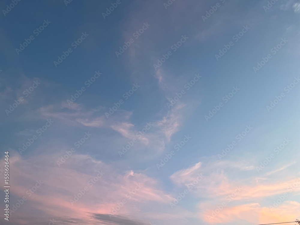 Fototapeta premium Beautiful pastel sky with soft clouds at sunset