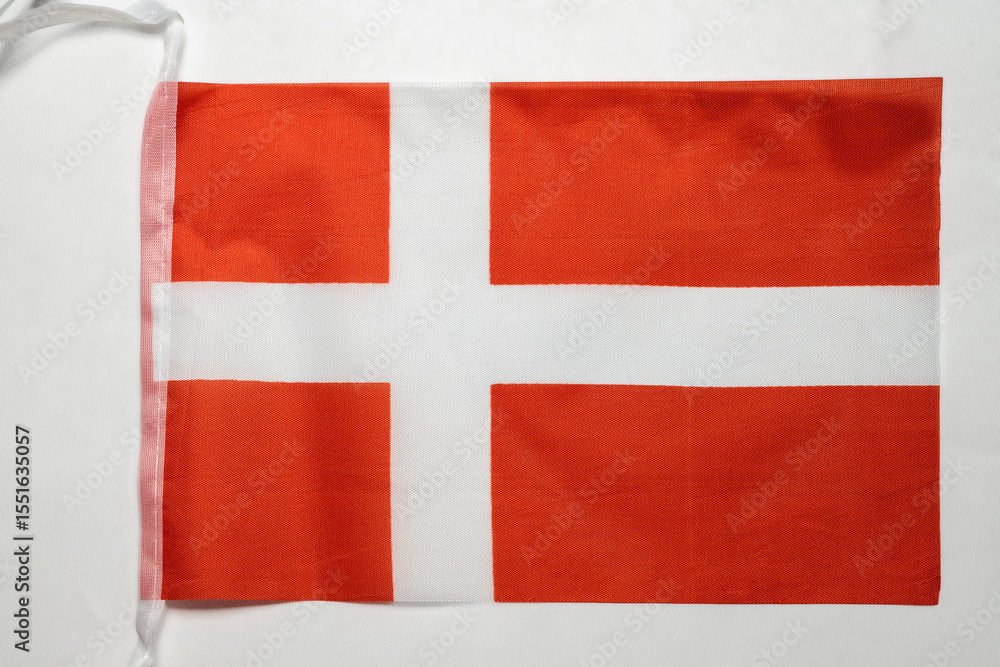 Fototapeta premium Closeup view of the Denmark national flag isolated over a white background. Concept of government and nationality