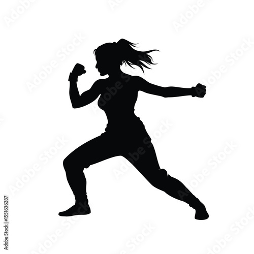 Silhouette of a determined woman practicing martial arts or self defense