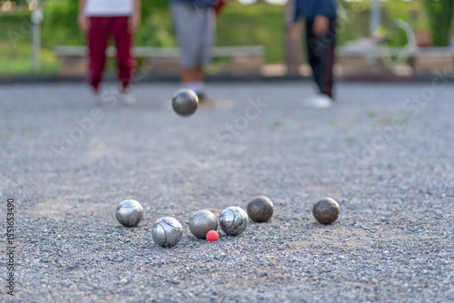 Cuadro en lienzo petanque practice on playing field,group of people throwing boules,selective foc