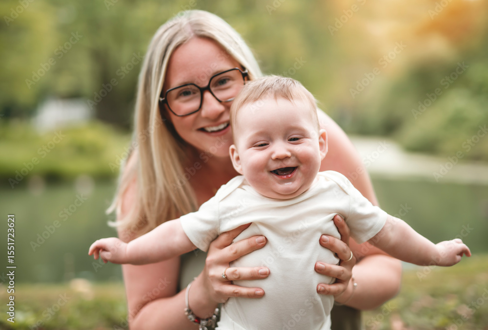 Fototapeta premium Happy family on a summer meadow. little girl child baby daughter with mother
