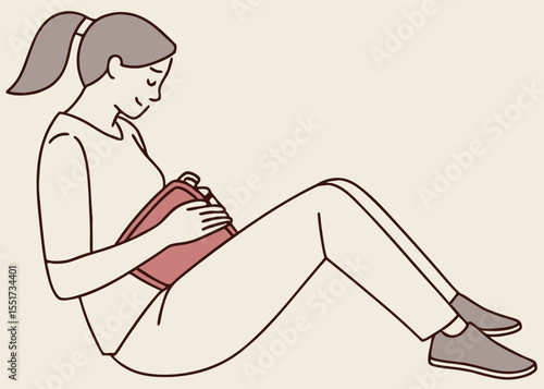 Woman using a hot water bottle for pain relief, with copy space