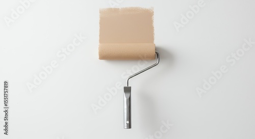 Paint roller against beige wall