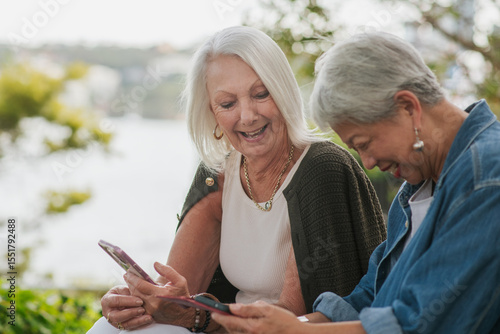 Seniors sharing stories about photos on their phone