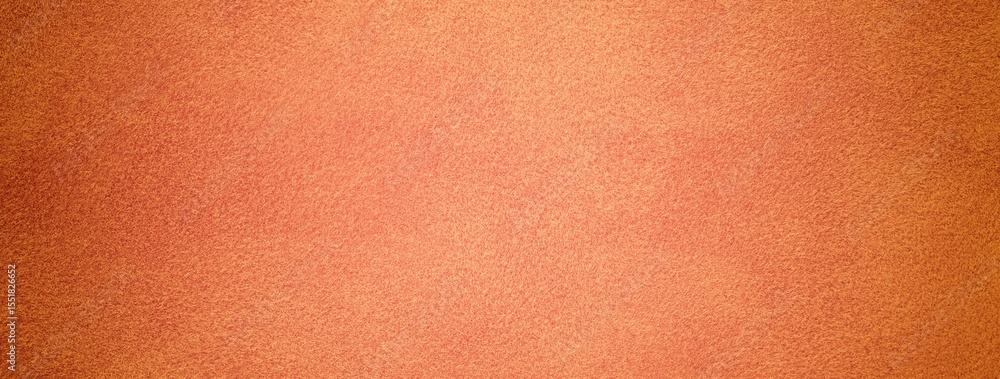 Fototapeta premium Orange suede fabric background with matte velvet texture, coral and peach tones and soft felt surface in macro