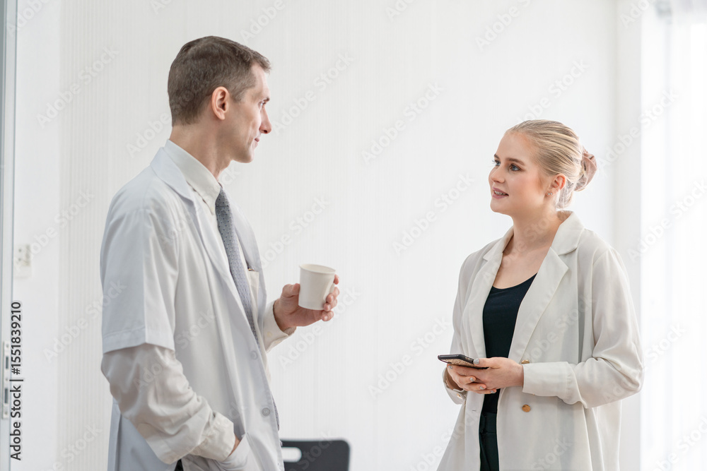 Senior male doctor and female patient discussing in detailed about health concerns and possible treatment plans at hospital. Medicine and health care concept Senior male doctor and female patient discussing in detailed about health concerns and possible treatment plans at hospital. Medicine and health care concept