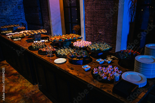 Slika na platnu A beautifully arranged buffet table showcasing a variety of colorful and delicious hors d'oeuvres
