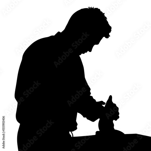 Man sculpting with clay silhouette on a dark background  