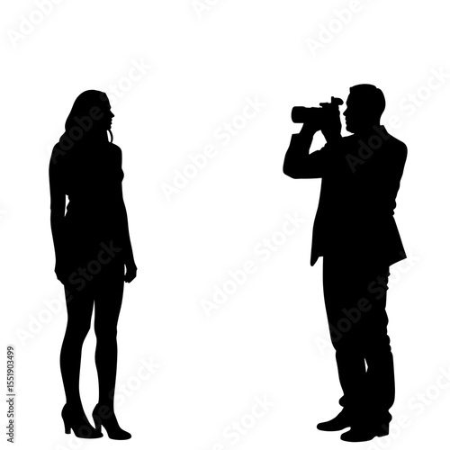 Man photographing woman silhouette in studio environment  
