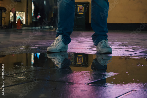 Wallpaper Mural A man standing next to a puddle Torontodigital.ca