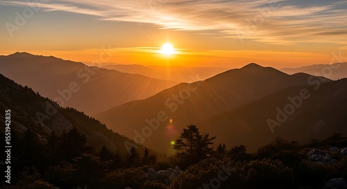 Wallpaper Mural Sunset Over Mountain Ridges with Golden Light and Clouds Torontodigital.ca