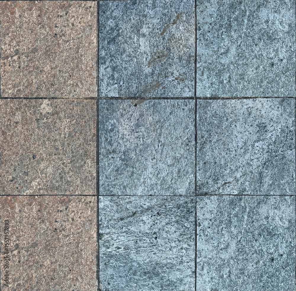 Fototapeta premium Close up of rough outdoor stone tiles in blue and brown red color. Suitable for pavement or sidewalk garden floor. Seamless background texture.