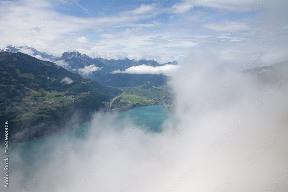 Obraz premium Summer Landscape in Amden, Swiss Alps, with Lake Walensee and Low Clouds