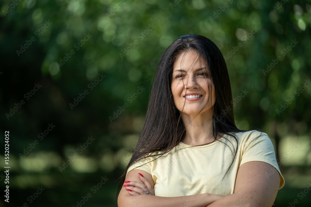 Close-up of smiling beautiful woman in sportswear with crossed arms, enjoying morning in park, healthy and positive lifestyle Close-up of smiling beautiful woman in sportswear with crossed arms, enjoying morning in park, healthy and positive lifestyle