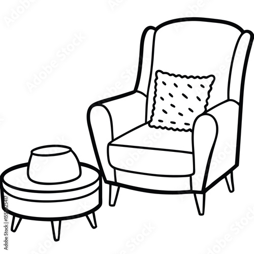 Cozy wingback armchair with decorative pillow and round ottoman perfect for relaxing or reading in a comfortable living room setting