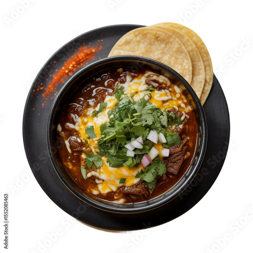 Birria Mexican food on black dish top view on white background well decorated
