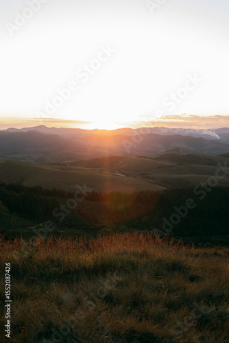 Reddish, golden and orange sunset between mountains