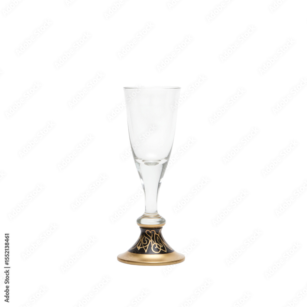 Obraz premium Elegant glass shot glass with decorative golden base 
