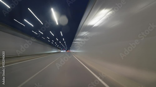 Fast driving through the city at night, time-lapse