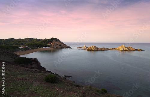 Beautiful quiet beach in Menorca during the sunset