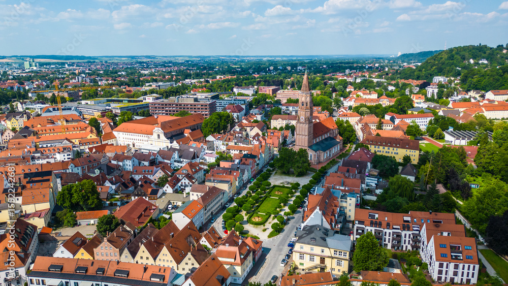 Landshut, a vibrant Bavarian town, viewed from the air. Features the medieval Trausnitz Castle on a hill and the striking Church of St. Martin with the tallest brick tower in the world Landshut, a vibrant Bavarian town, viewed from the air. Features the medieval Trausnitz Castle on a hill and the striking Church of St. Martin with the tallest brick tower in the world