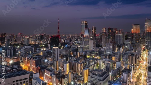 tokyo city downtown skyline aerial view time lapse night to day,pan timelapse of sun rising over high-rise business buildings skyscrapers of modern town