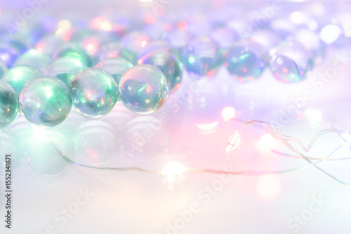 Iridescent Glass Marbles with Glowing String Lights – Dreamy Close-Up in Green and Pink Tones for Artistic Visual Concepts, Interior Styling, and Elegant Decorative Applications in Creative Contexts