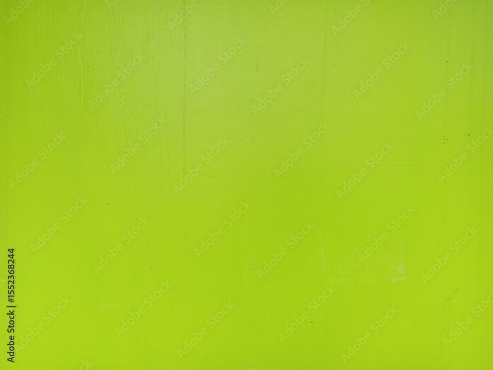 Obraz premium Vivid Lime Green Wall with Subtle Textural Variations