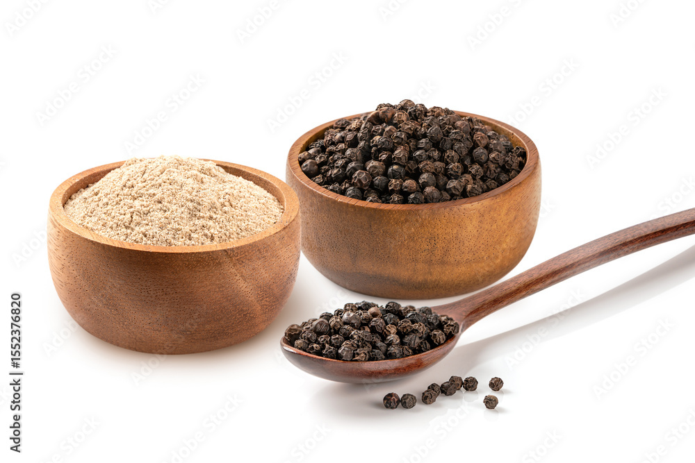 Black pepper and ground black pepper in a wooden bowl and spoon isolated on white background. Black pepper and ground black pepper in a wooden bowl and spoon isolated on white background.