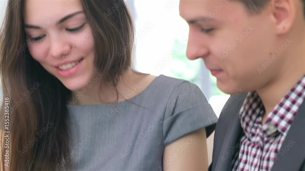 Engaging discussion between a young business man and woman Engaging discussion between a young business man and woman