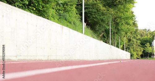 Wallpaper Mural Sporty woman running at stadium, low angle view Torontodigital.ca