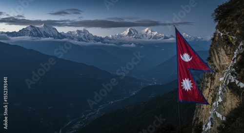 Himalayan Majesty: Nepali Flag at Dusk Over Snow-Capped Peaks