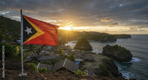 Sunset View of a Coastal Village with the Flag of Timor-Leste