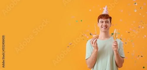 Young man with birthday cak...